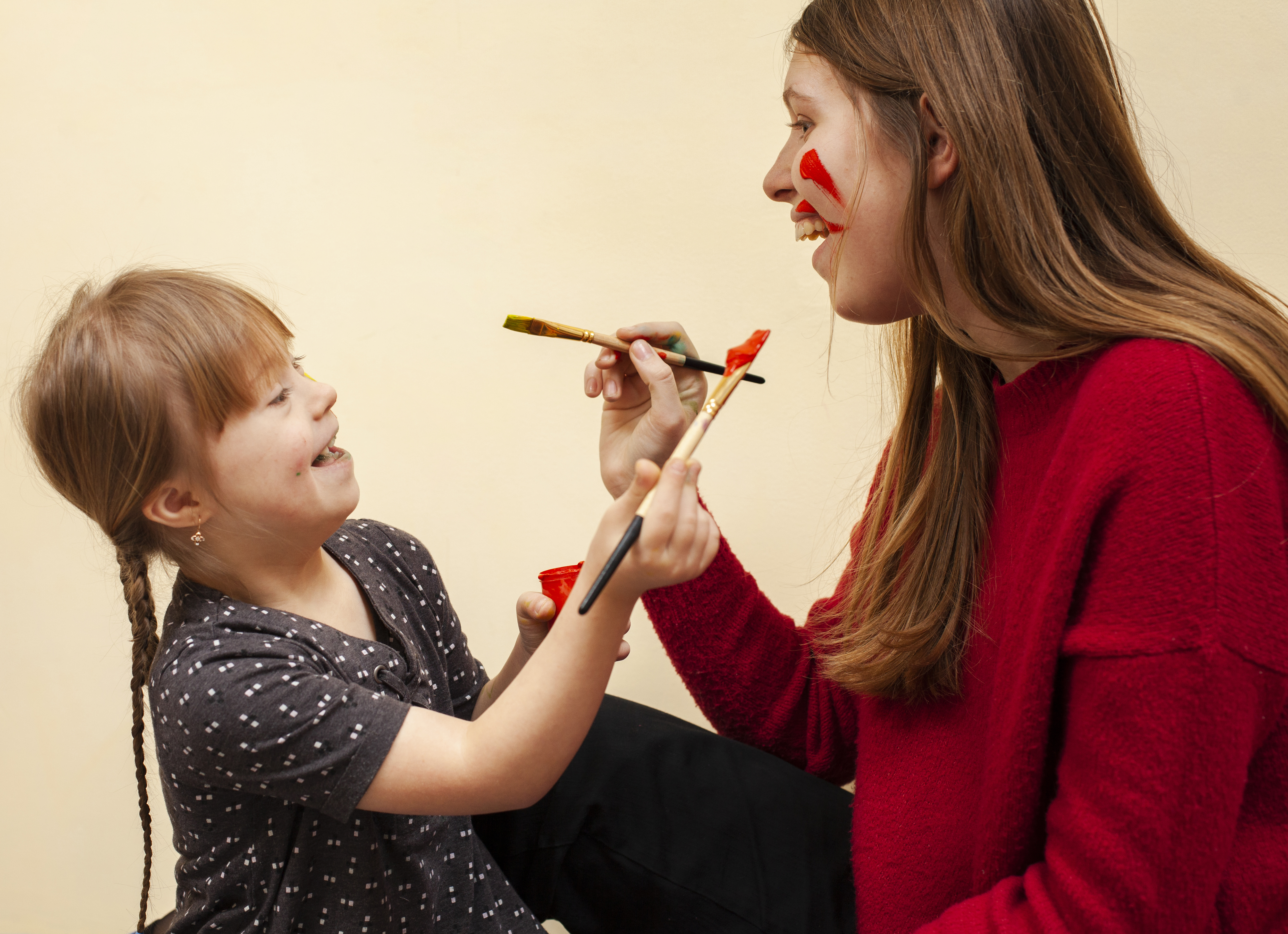 Credit freepik com happy woman girl with down syndrome painting each other s faces