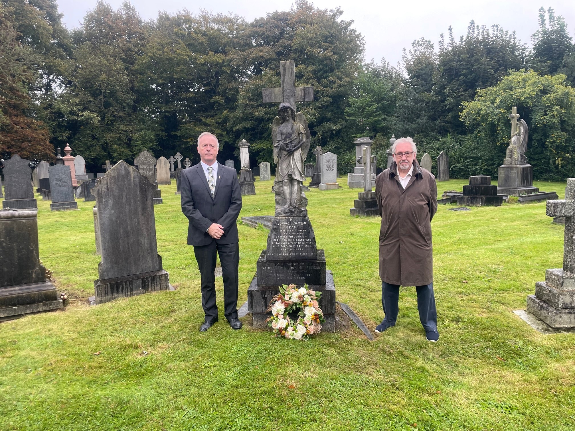 Cllr le marinel and cllr nicholls at the final resting place of jean stansfield