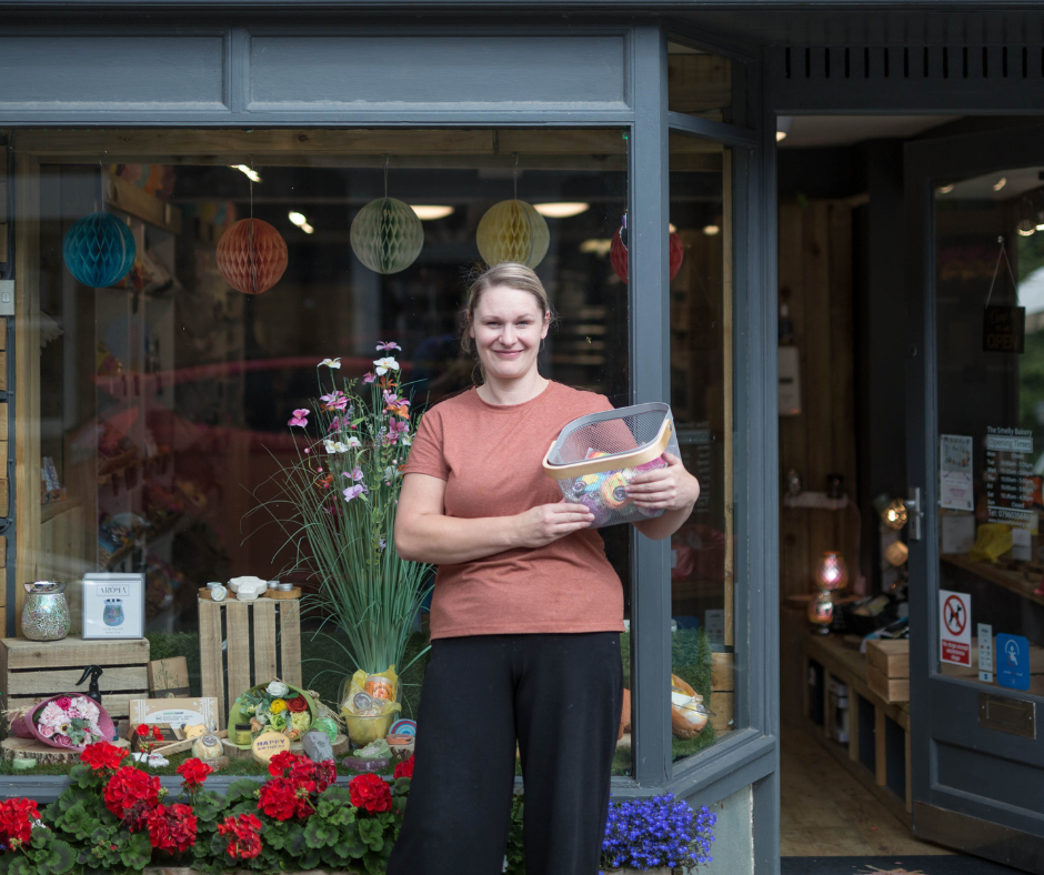 Business owner stood outside shop