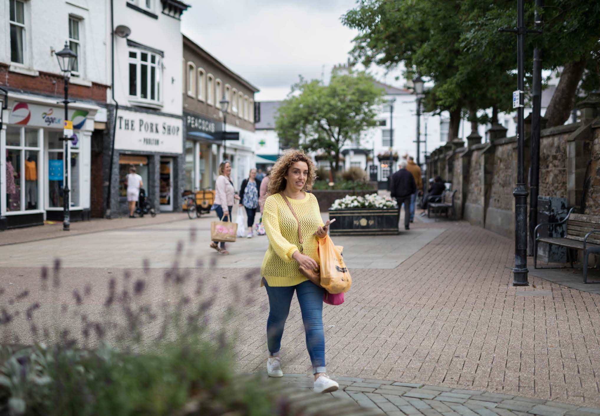 Person walking down the main shopping street in Poulton-le-Fylde