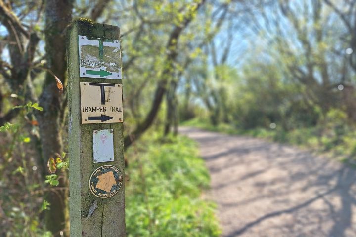 Signs on a post leading to the Wyre Estuary Park tramper trail