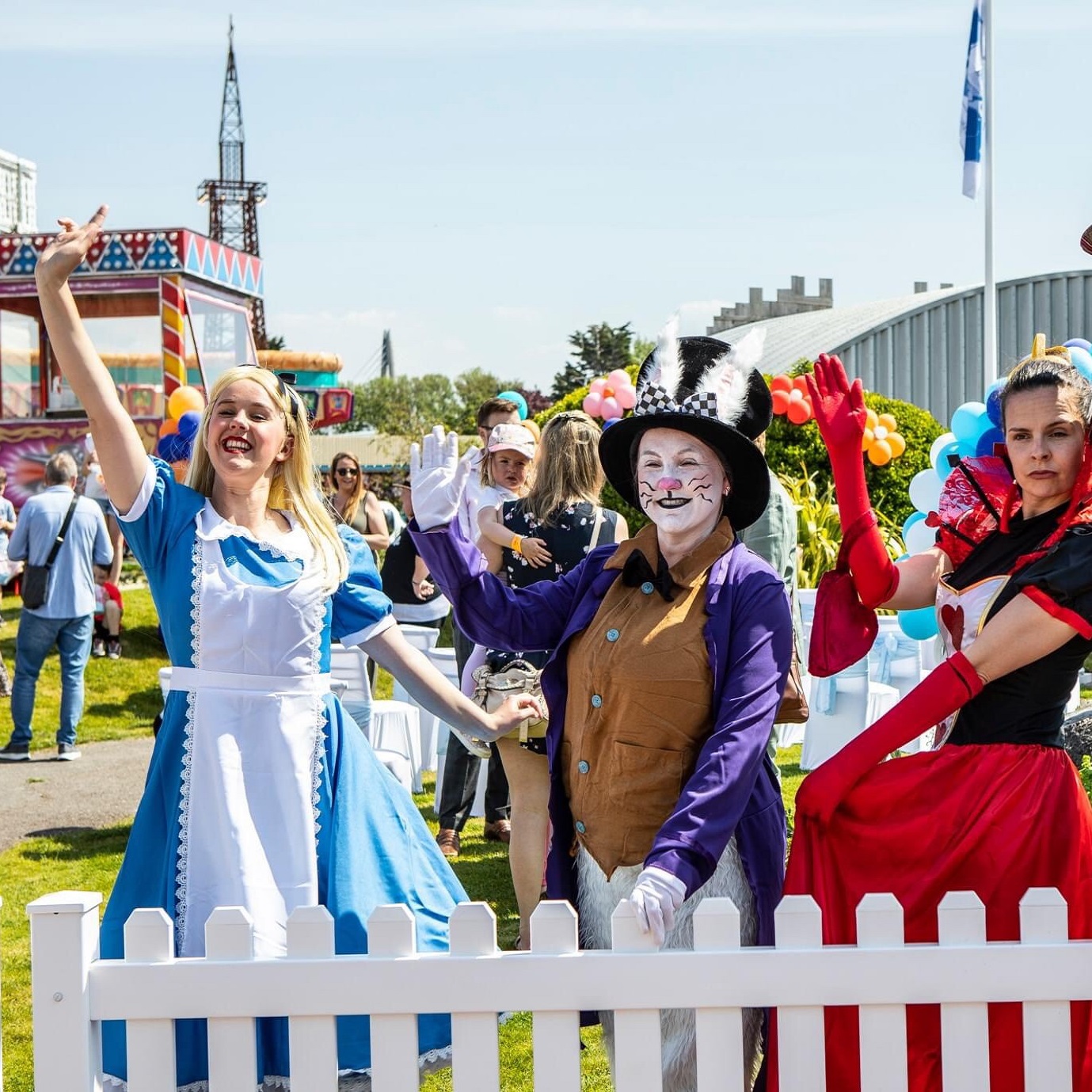 Actors dressed as Alice in wonderland costimes