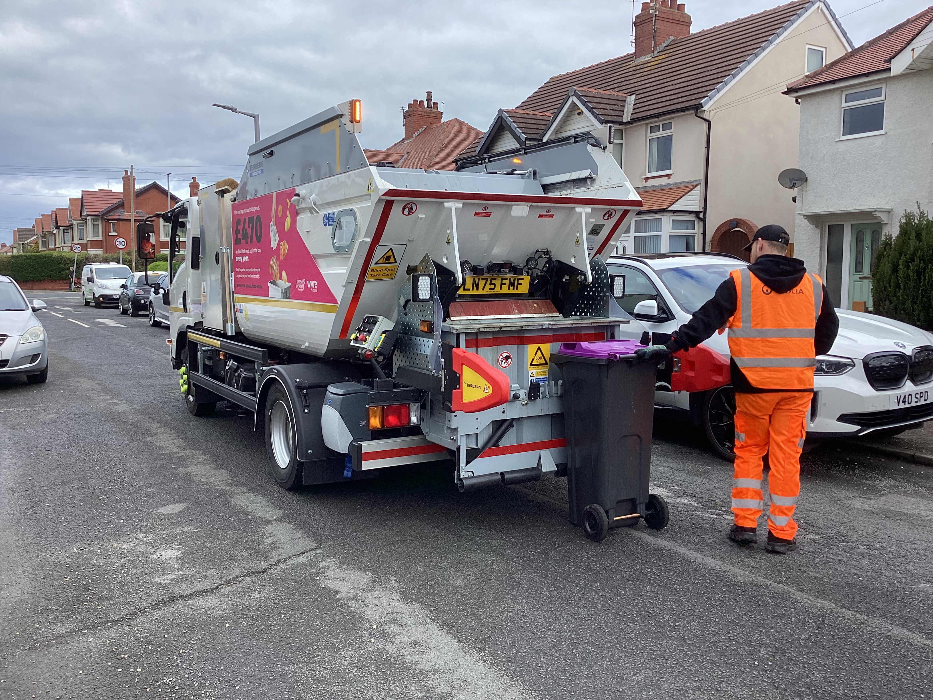 Bin lorry collecting waste