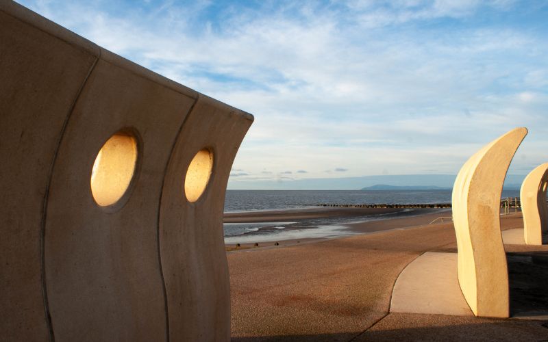 Sea defences at Cleveleys beach. Big stone barriers to break up waves on the seafront.