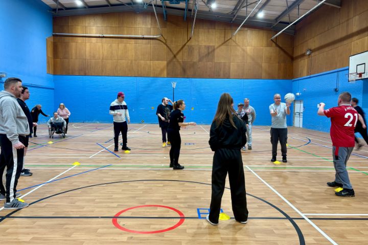 People playing basketball on an insider court.
