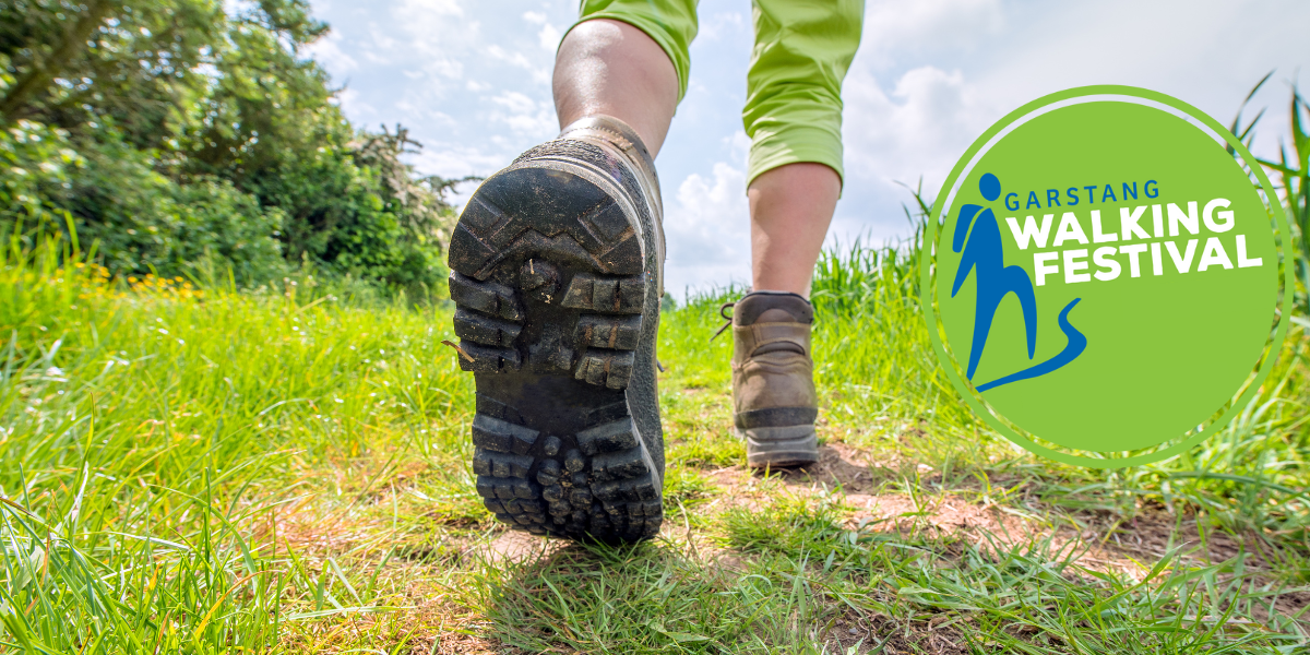 Person walking and the Garstang Walking Festival logo