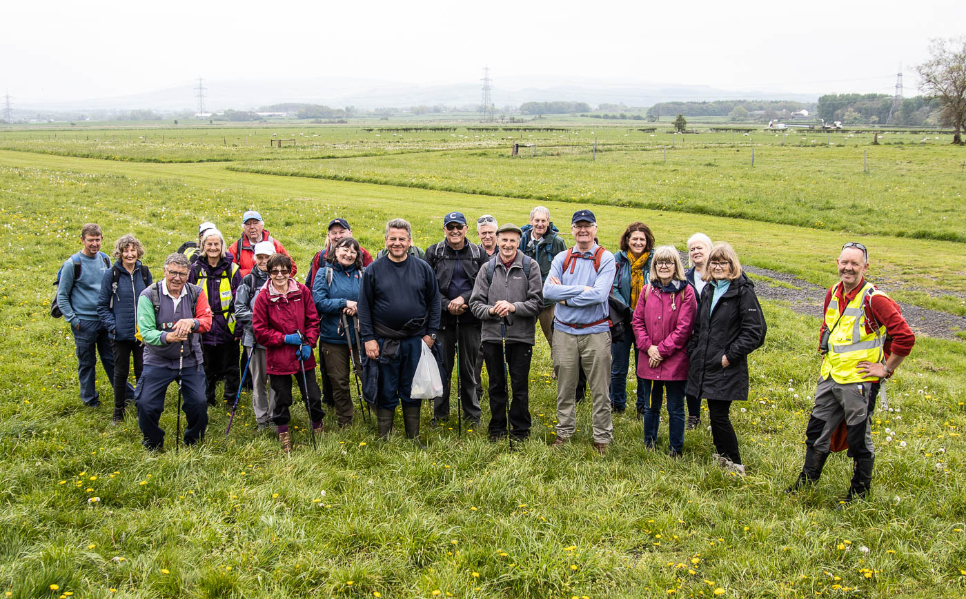 Group of people stood in field attending one of the Garstang Walking Festival events
