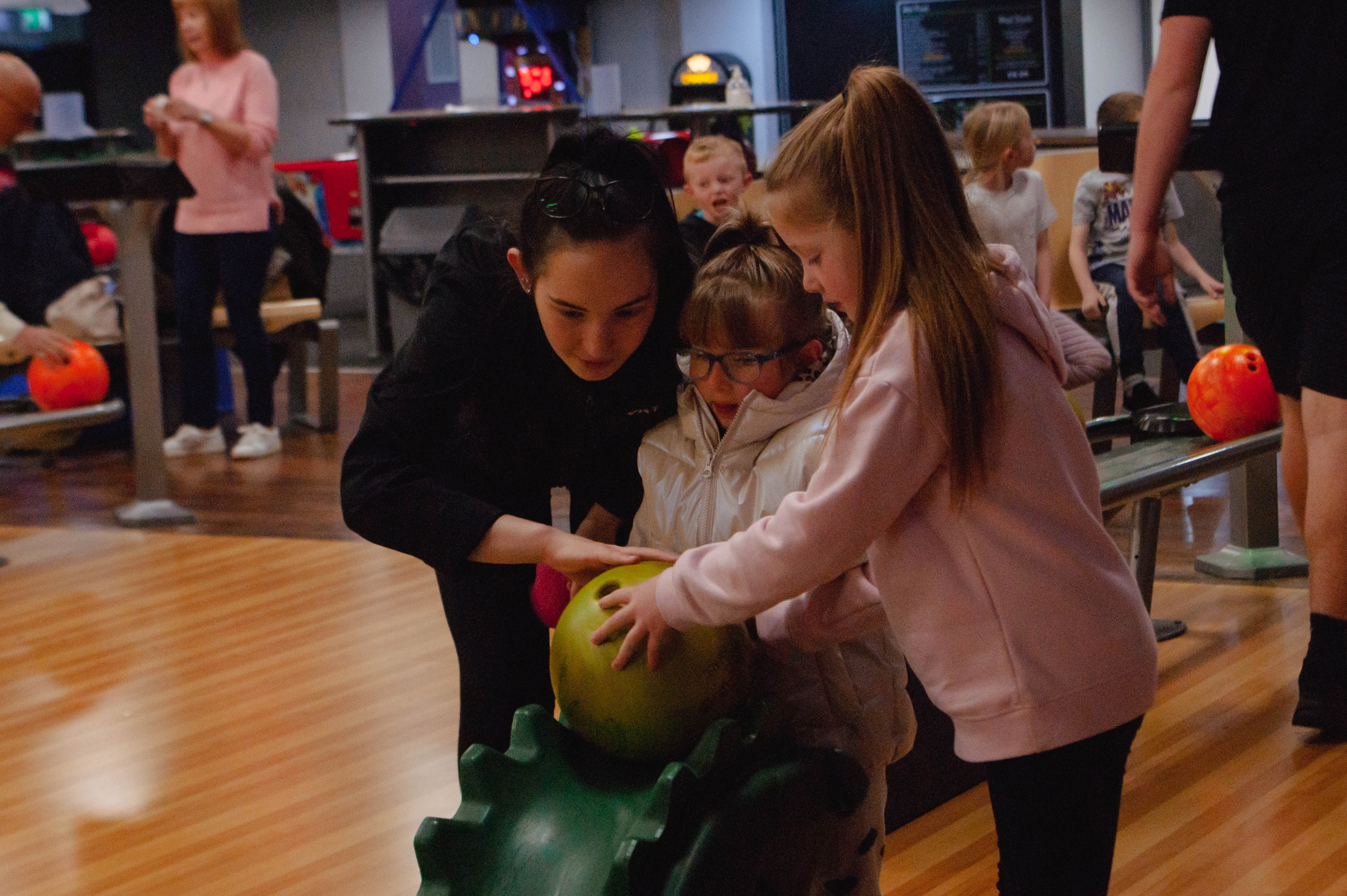 Children bowling at a holiday club at YMCA Thornton.