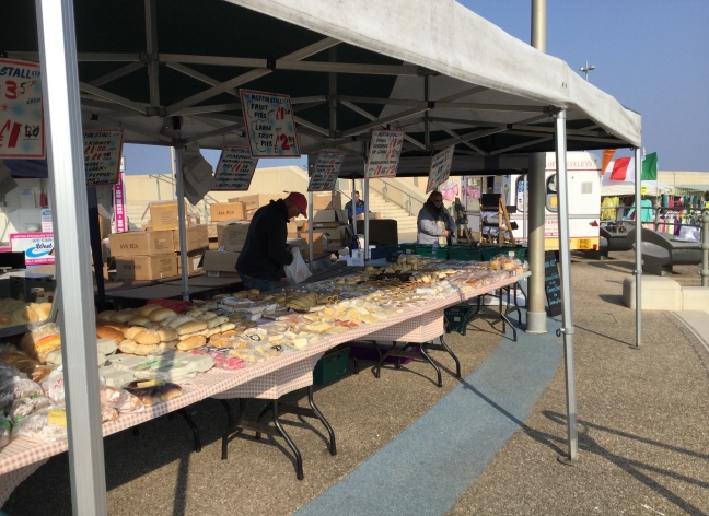 Traders working at a market stall