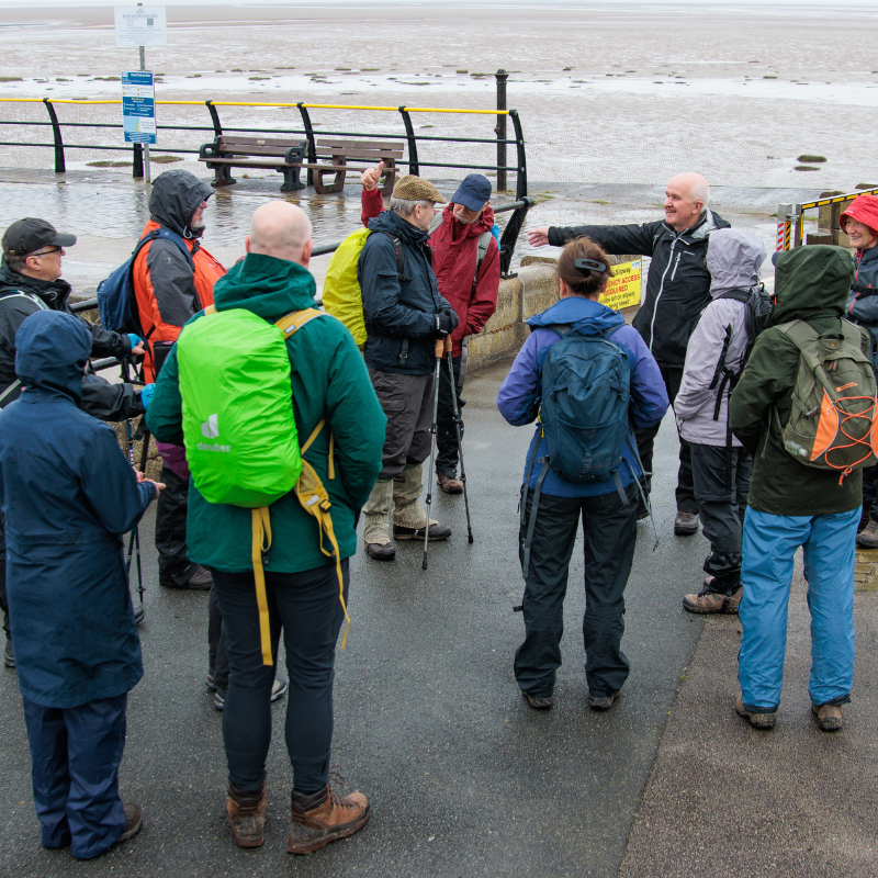 Group of walkers on the slip way at Knott End