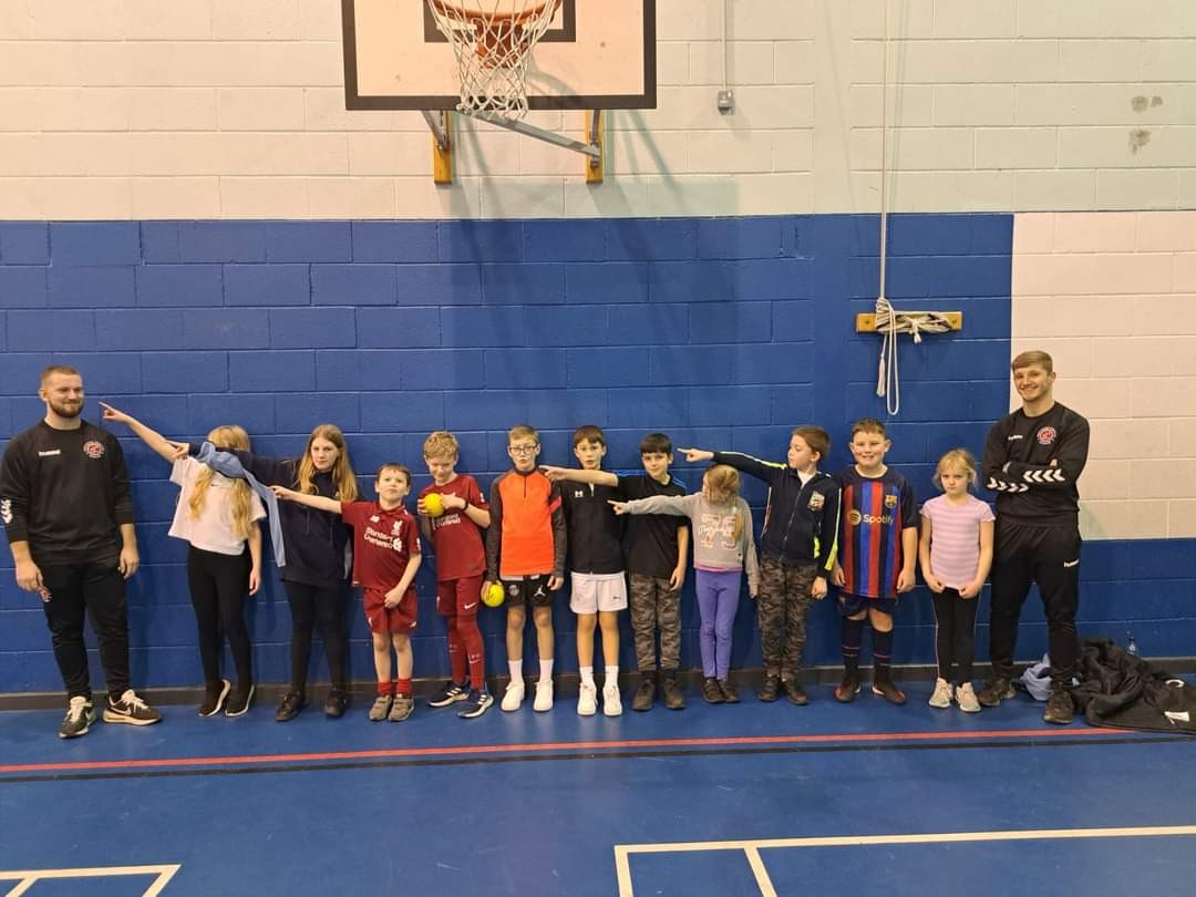 children at a trysport session with the instructors