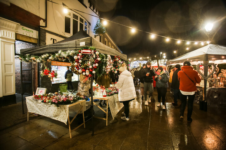 People browsing the outdoor Christmas festival in Poulton 2021.