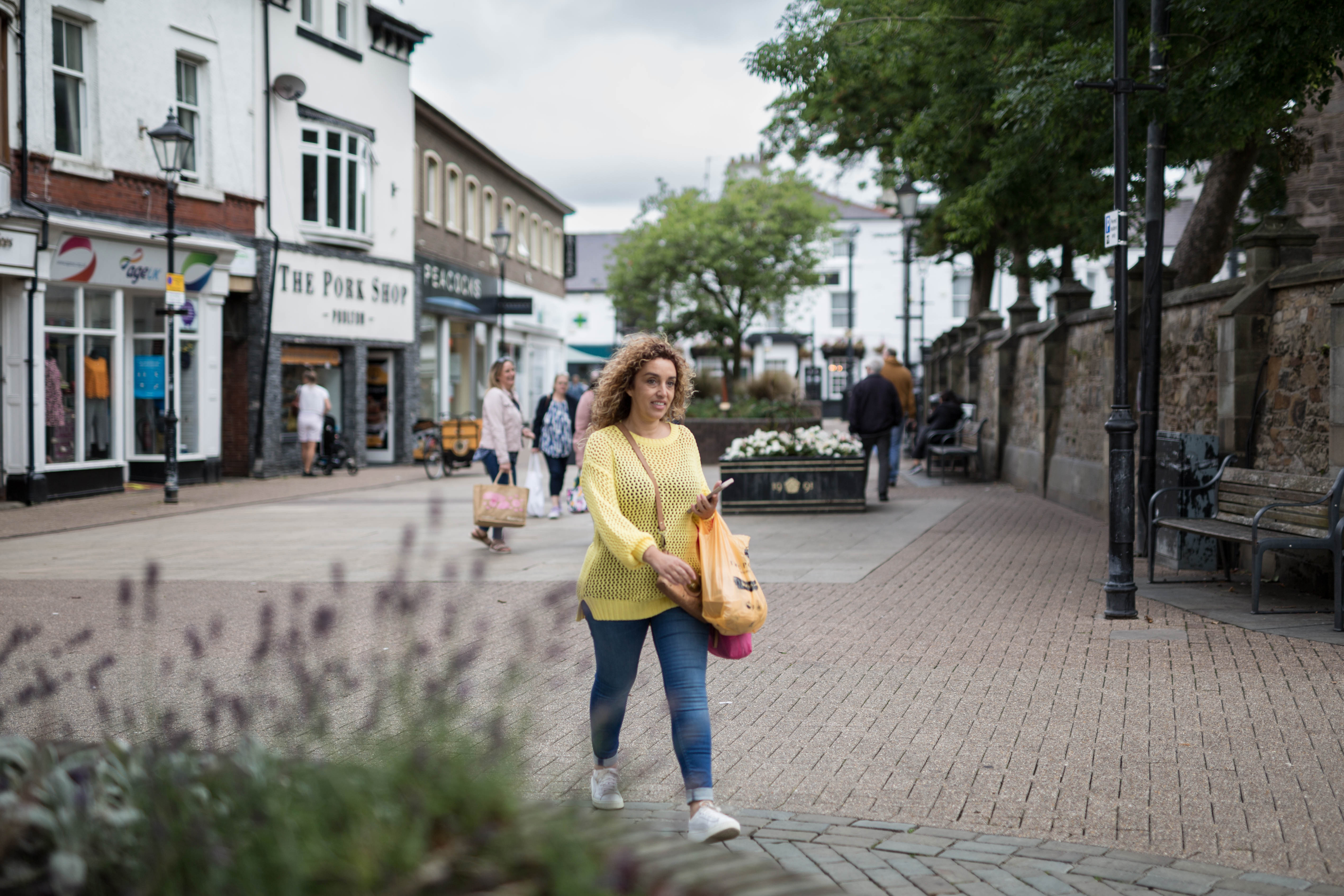 Woman walking down down Poulton high street