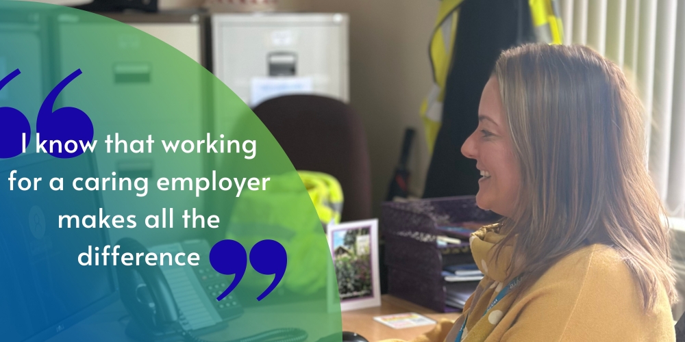 Sandra, Cleaner Greener Project Manager at Wyre council is working at her computer desk with the quote "I know that working for a caring employer makes all the difference."