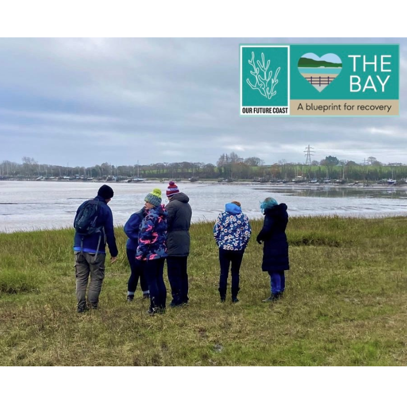 The Bay logo with a group of people on wyre estuary