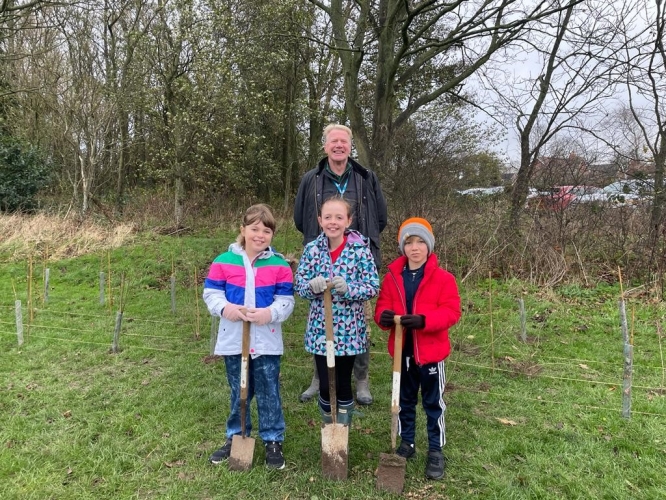 Tree planting with Cllr Bridge and pupils from St John's primary school