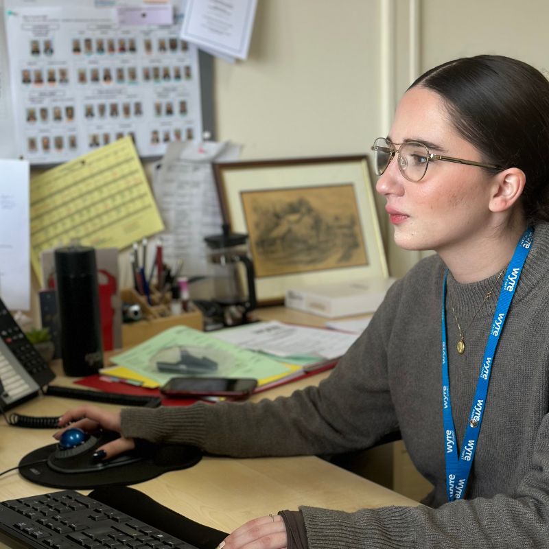 Daphne working at her pc at her desk in Wyre council civic centre.