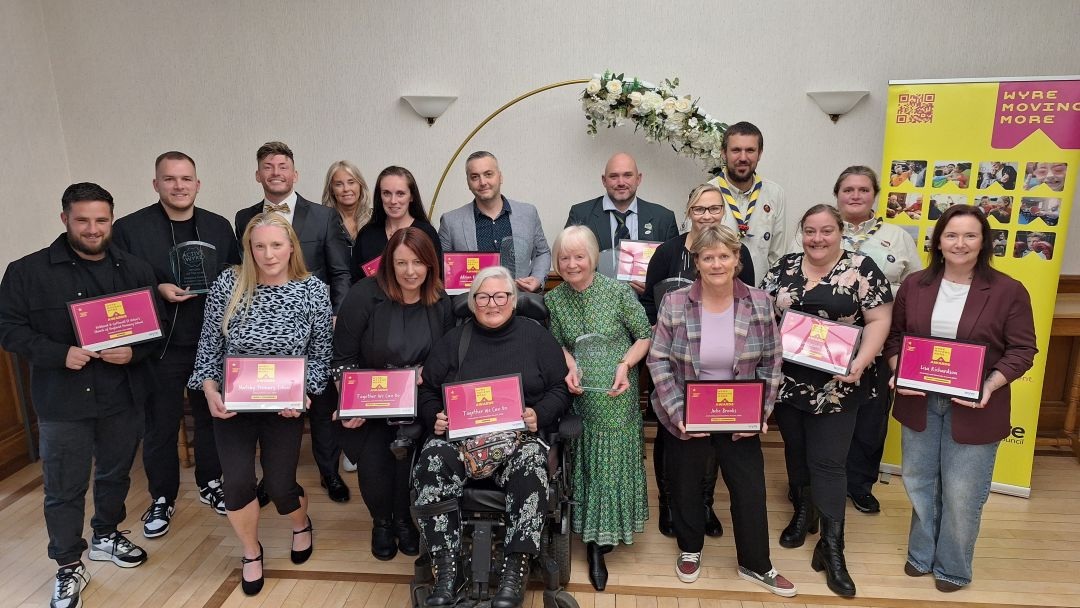 Winners of the Wyre Moving More awards holding their certificates.