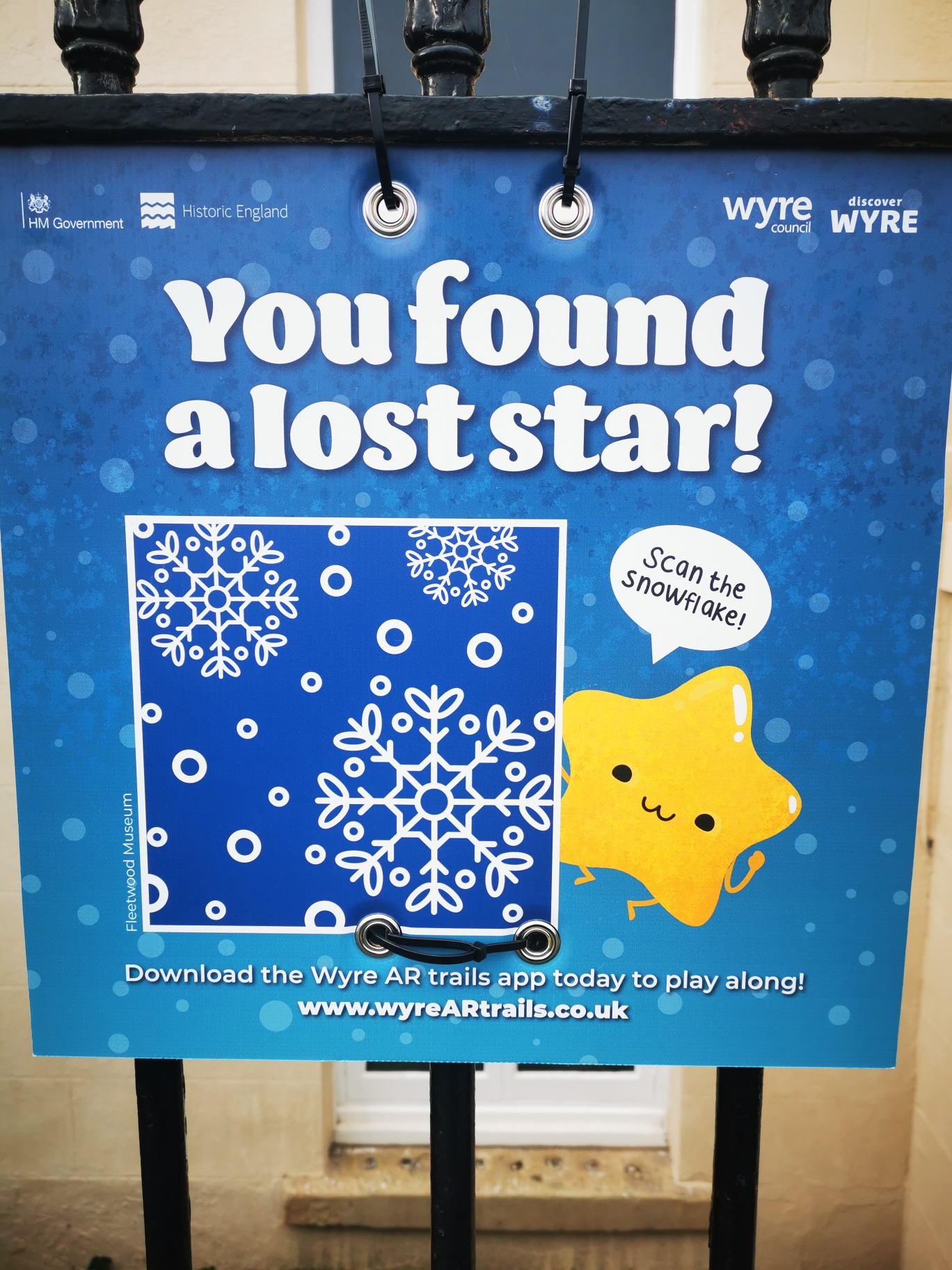 Poster with text 'You found a lost star!'. A cartoon star asks people to 'Scan the snowflake!'. Users need to Download the Wyre AR trails app today to play along! www.wyreARtrails.co.uk