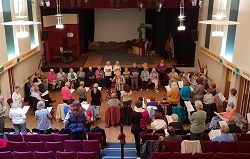 Singing group gathered in thornton little theatre