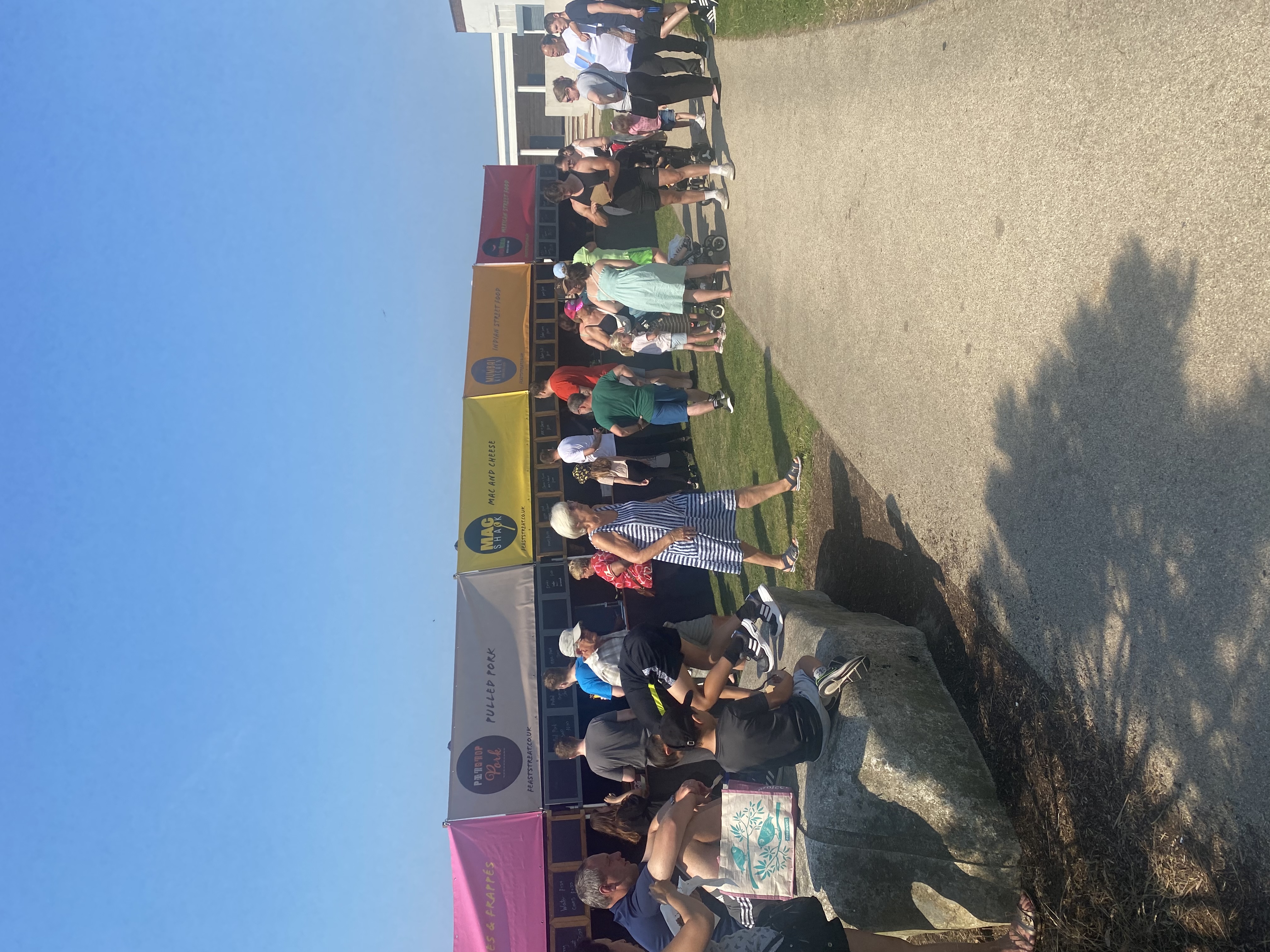 People stood at food stalls
