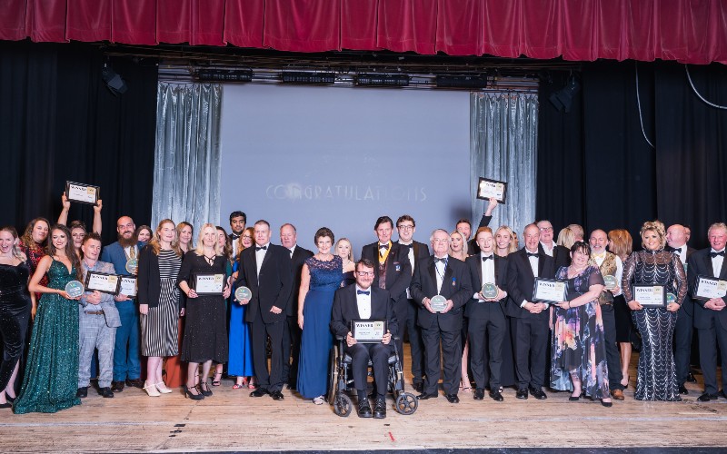 Attendees at Wyre Business Awards posing with awards won.