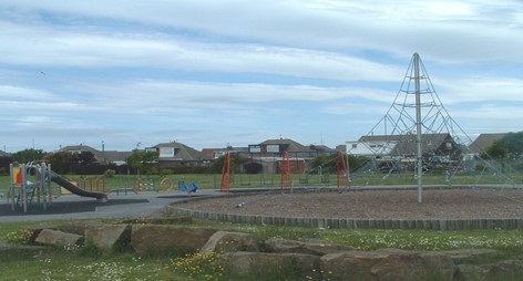 View of children's outdoor play area and climbing frame at North Drive Park in Cleveleys.