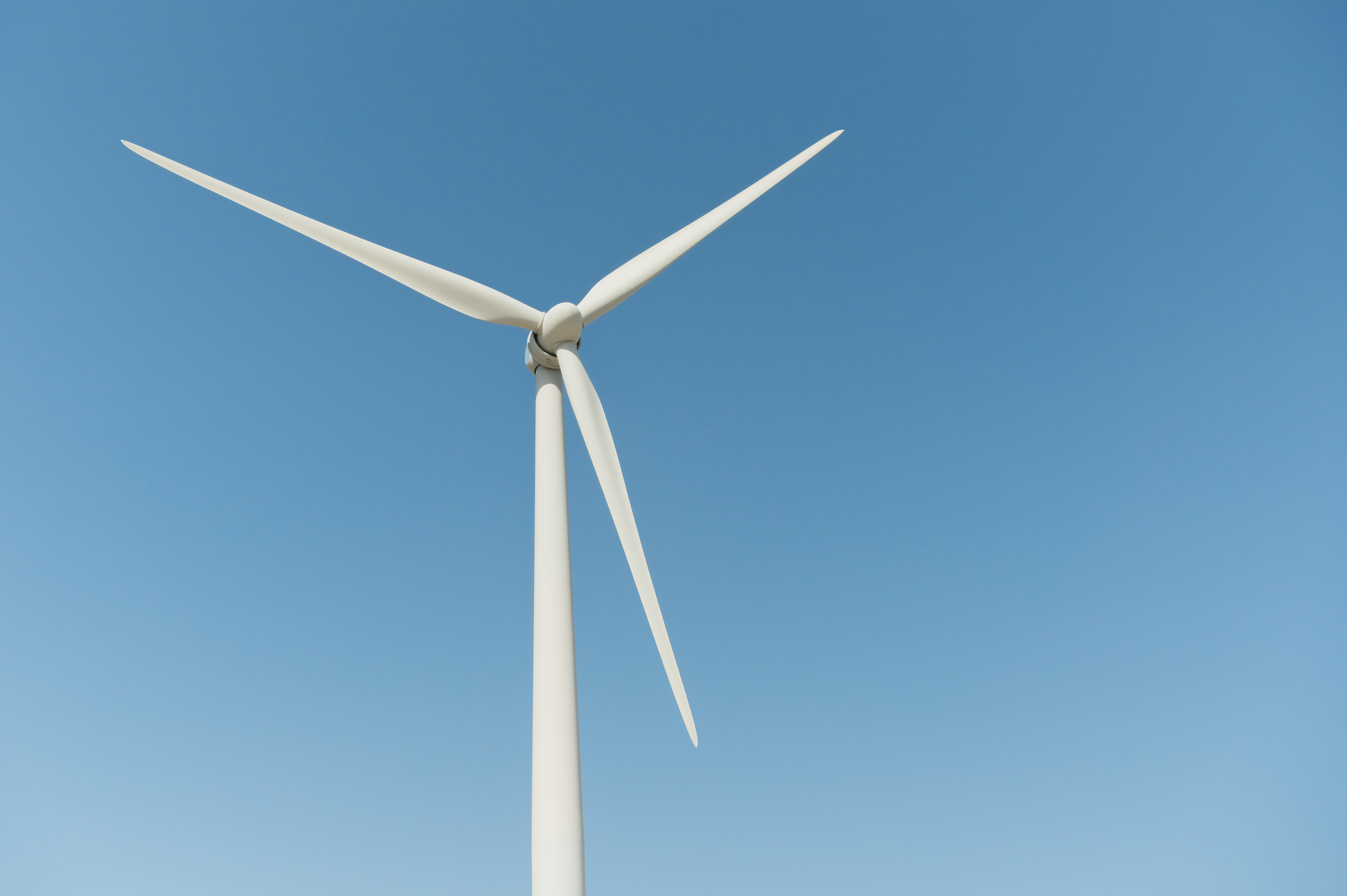 Wind turbine against a blue sky